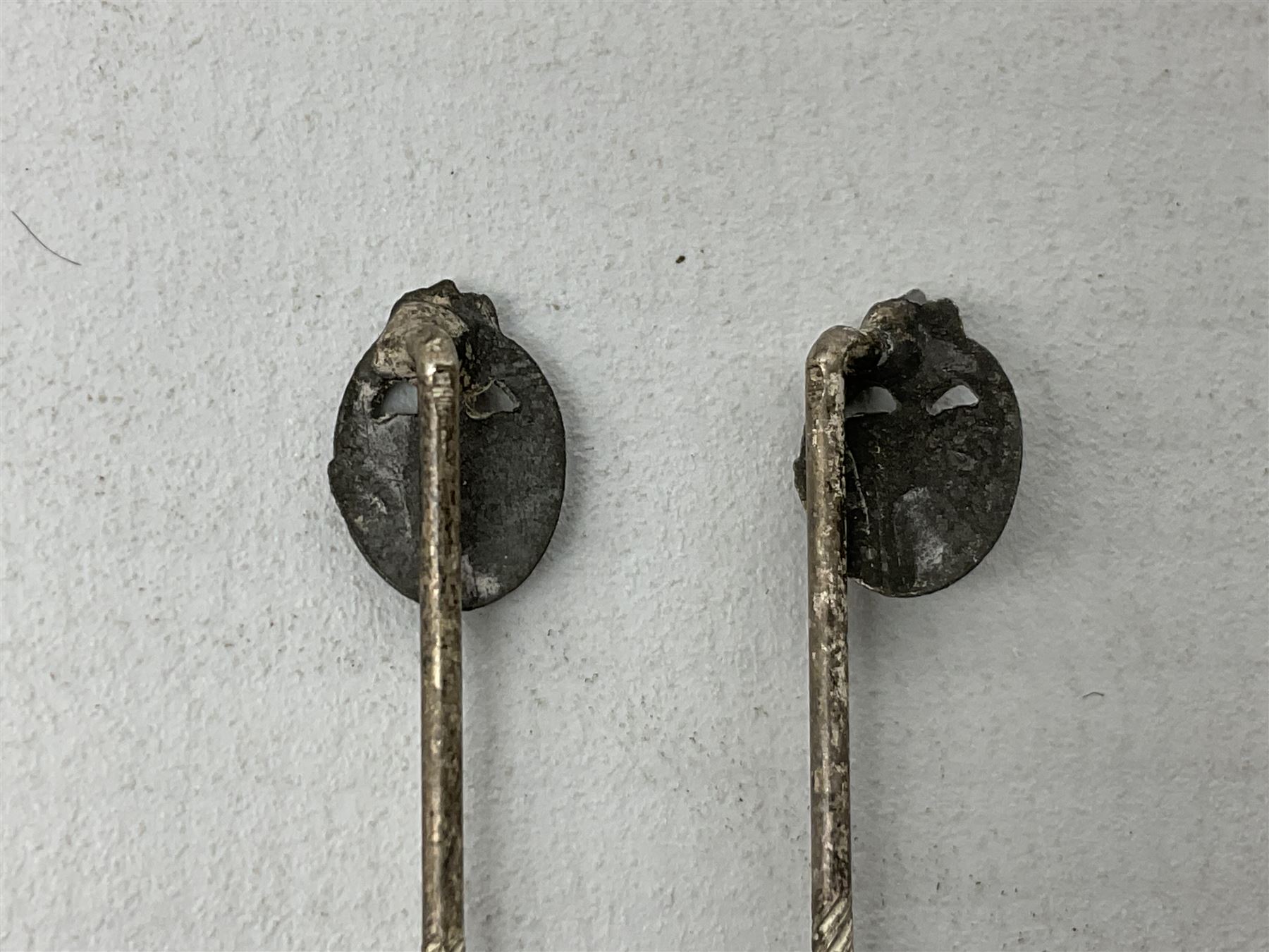 Nine WW2 German lapel pins including five Infantry Assault, Tank Assault etc 