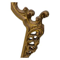 Victorian design gilt framed overmantel mirror, the arched and moulded frame adorned with scrolling foliate motifs and acanthus leaves, surmounted by a pierced cartouche, plain mirror plate, resting on a shaped base