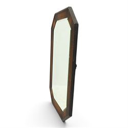 Early 20th century oak wall mirror, canted rectangular frame with bevelled plate 