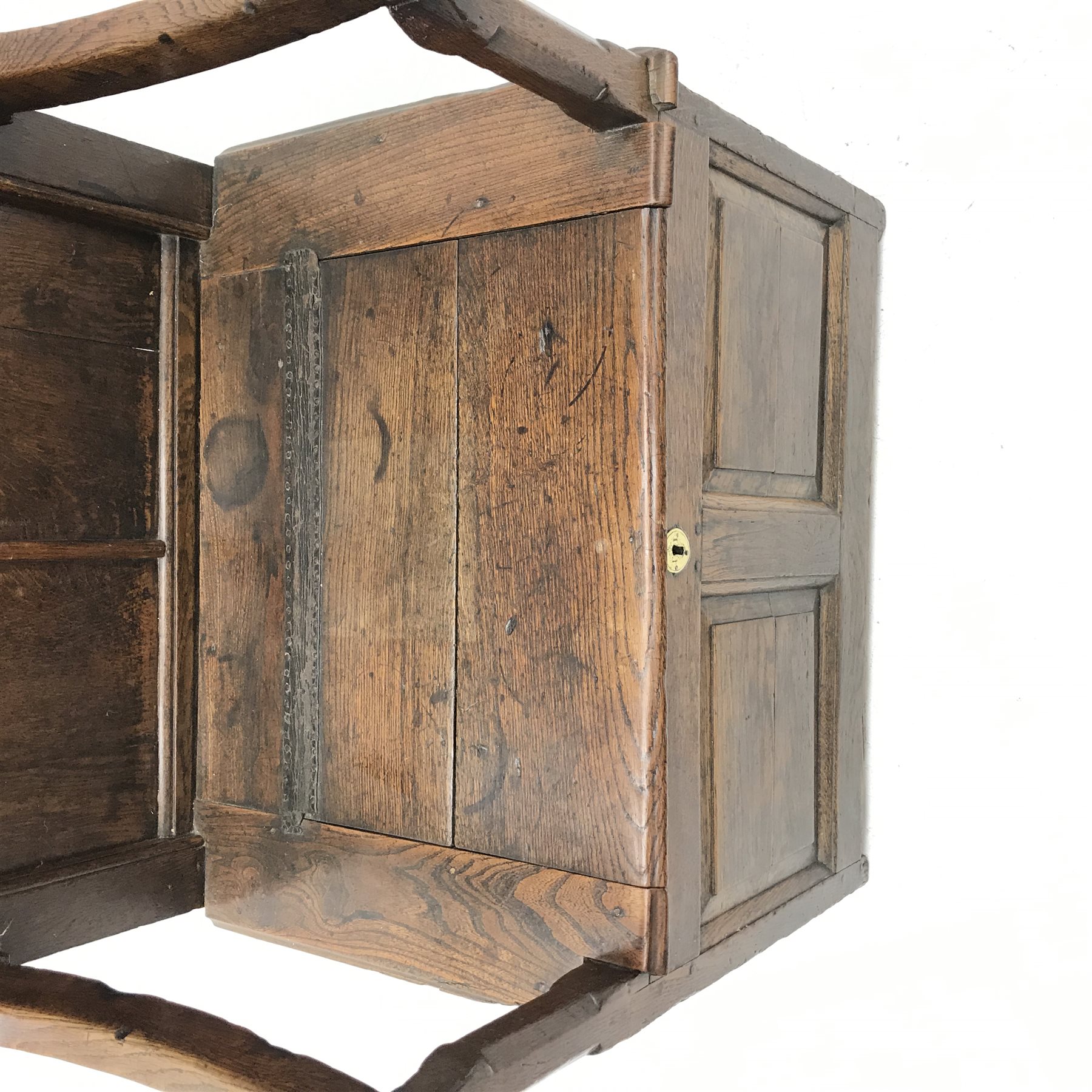 18th century oak box seat settle, panelled back, cresting rail initialled 'T.I', the moulded seat with hinged lid, down swept arms on octagonal faceted supports, fielded panelled base, engraved brass escutcheon initialled again 'T.I', W80cm, H149cm, D59cm