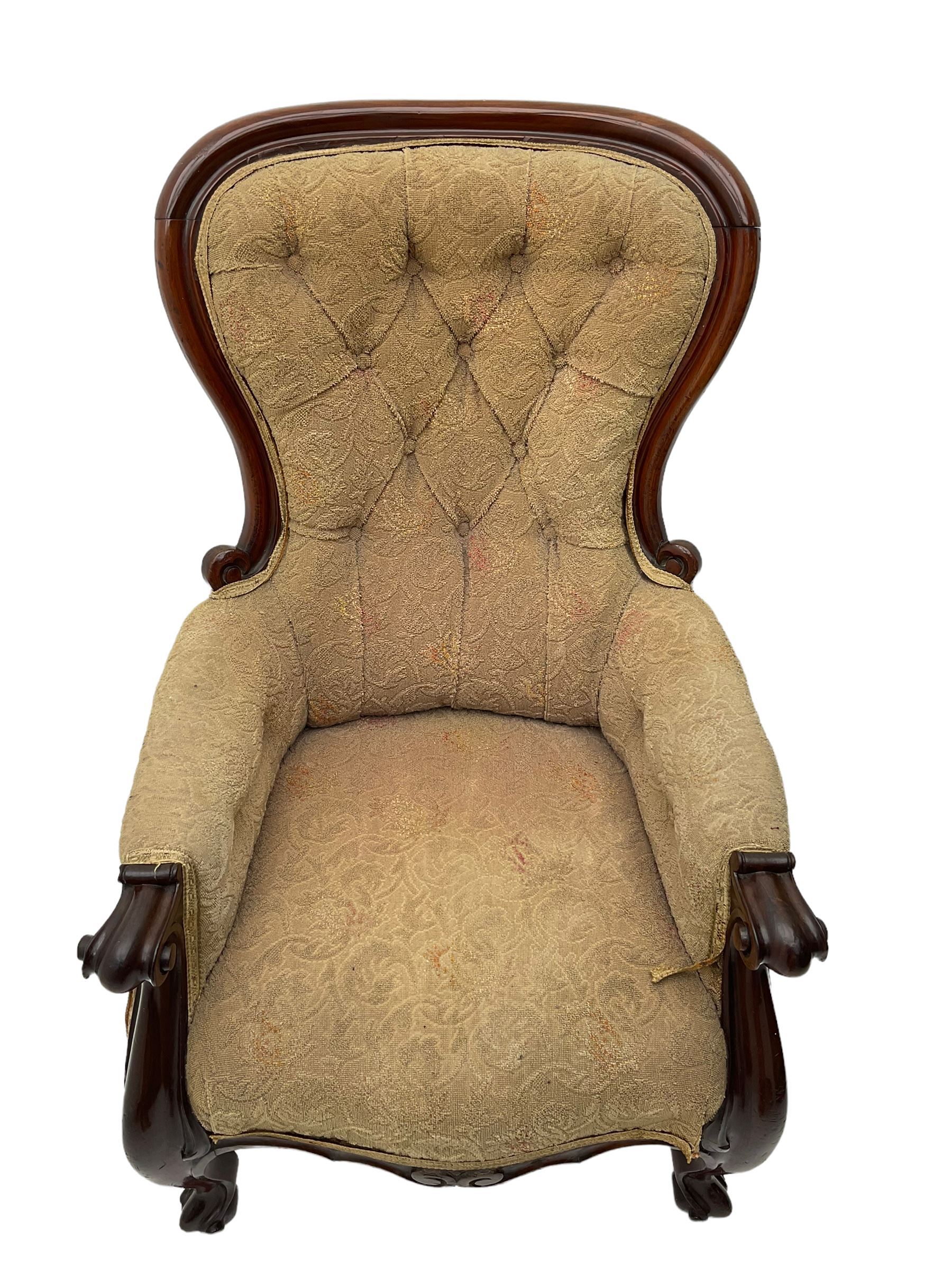 Victorian mahogany upholstered armchair, moulded framed, scroll carved arm terminals on scrolled cabriole supports, shaped carved apron