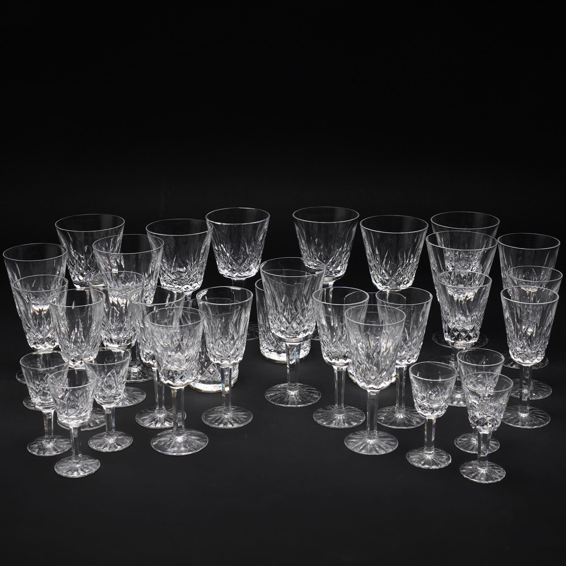 Waterford 'Lismore' pattern part suite, comprising three small tumblers, six liqueur glasses, twelve sherry glasses, eight large wine glasses and three smaller examples