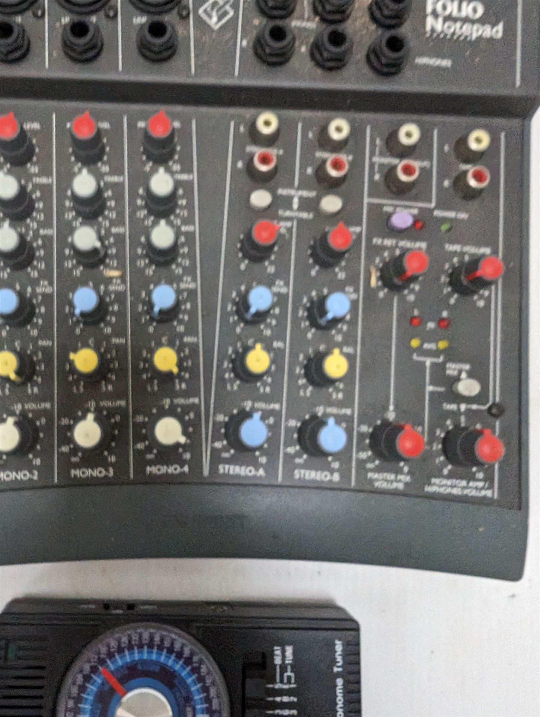 Spirit Folio Notepad mixer, together with a Roland pedal and a Suntech metronome tuner