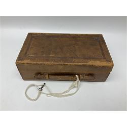 19th century apothecary leather carrying case, with key, the hinged lid opening to reveal seventeen glass medicine bottles with stoppers, most with chemist labels, gram scales, and domestic medicines booklet, H9cm, L27cm