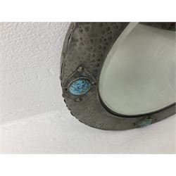 Arts & Crafts style circular hammered pewter mirror inset with four turquoise cabochons, D27.5cm