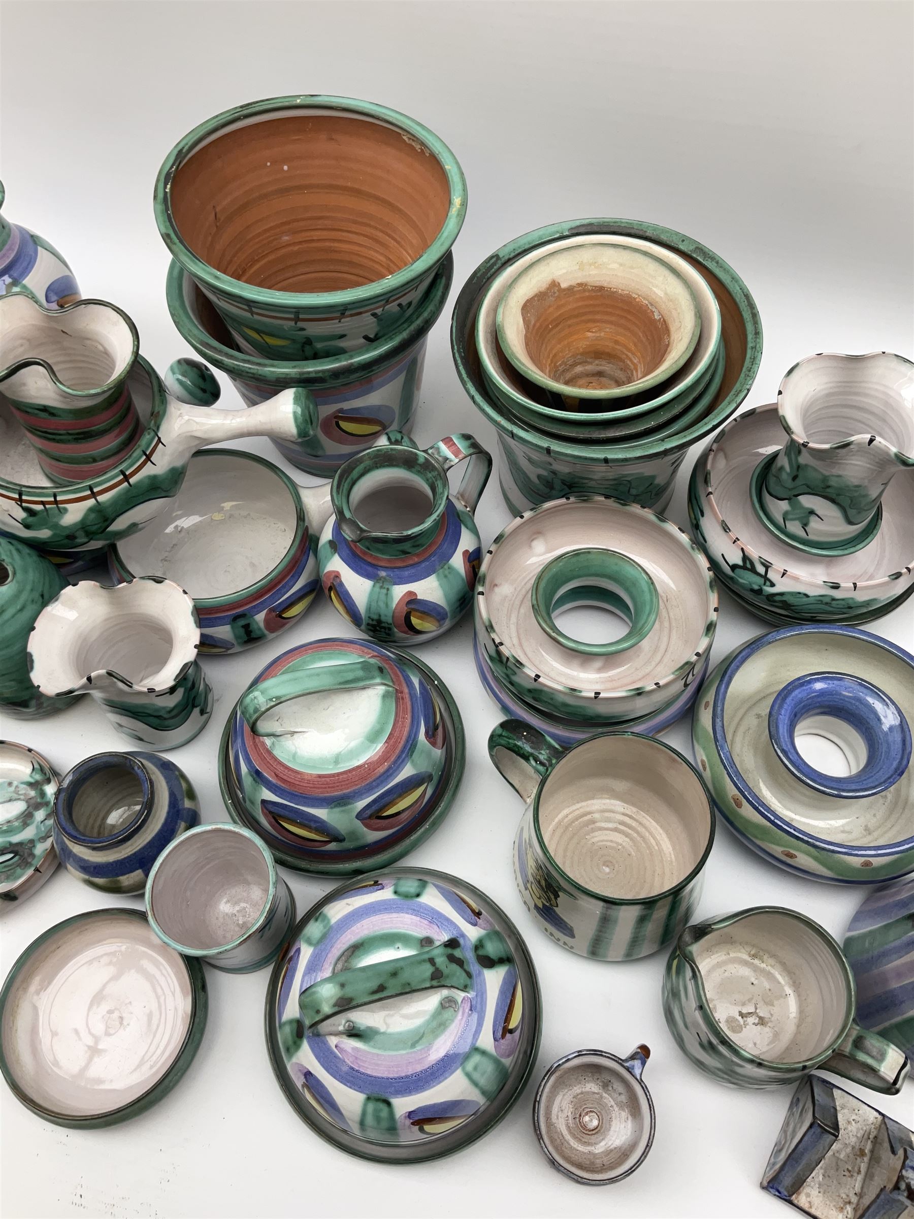 A collection of Tintagel Cornish pottery, to include various planters, jugs, vases, etc., a number of pieces decorated in dragon pattern. 