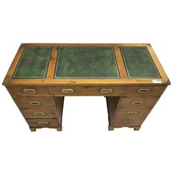 Late 20th century yew wood military design twin pedestal desk, rectangular top with three inset leather panels, fitted with nine drawers, brass brackets and recessed brass handles, on bracket feet