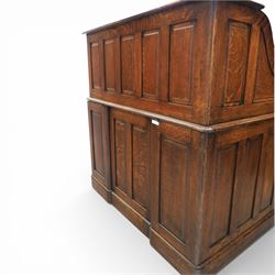 Globe Wernicke - Oak roll top desk, tambour roll top enclosing a fitted interior, raised on two pedestal bases with fitted drawers, raised on a plinth base 