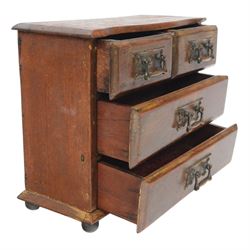 Table top chest of drawers, of rectangular form, with two short and two long drawers, raised upon bun feet, H22cm