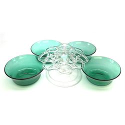 A set of four early 19th century Bristol green glass finger bowls, circa 1820, D12cm, together with with a Georgian clear glass flower frog with folded foot, H10.5cm L15.5cm.