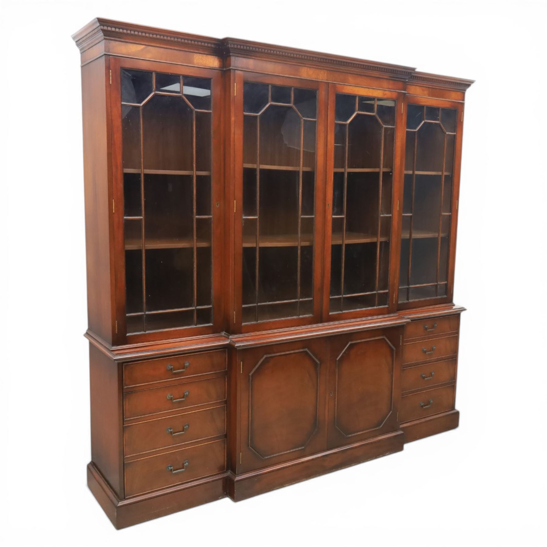 Wade Furniture - Georgian design mahogany breakfront bookcase cabinet, featuring four astragal glazed doors, above eight drawers and two cupboards, one fitted cutlery drawer