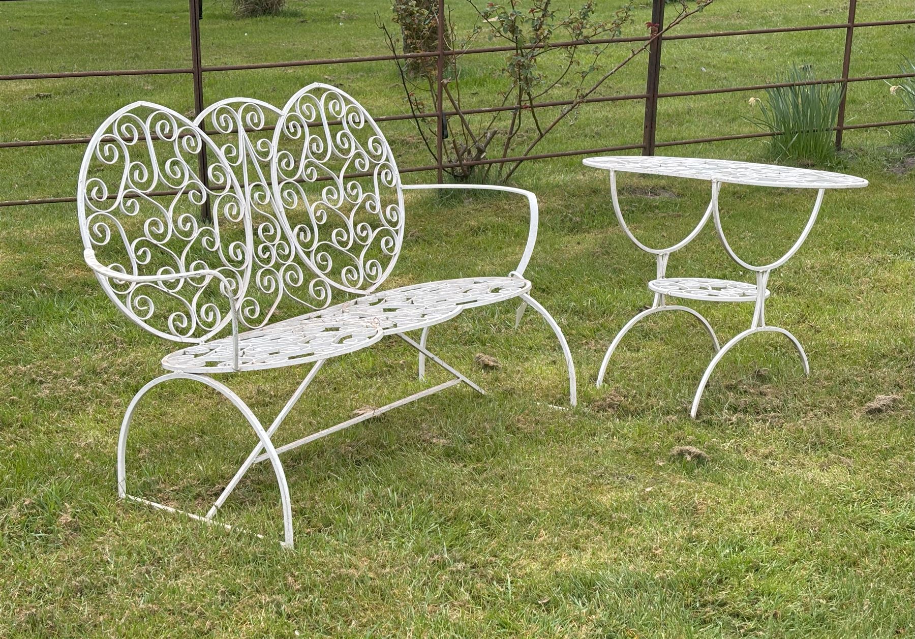 Modern aluminium scrolled two seat garden bench (H83cm, L122cm, D60cm) and a matching table (L76cm.) - COLLECTION BY APPOINTMENT FROM: The White House, Thirsk Road, Easingwold, York, YO61 3NF - CALL 01723 507111 TO ARRANGE