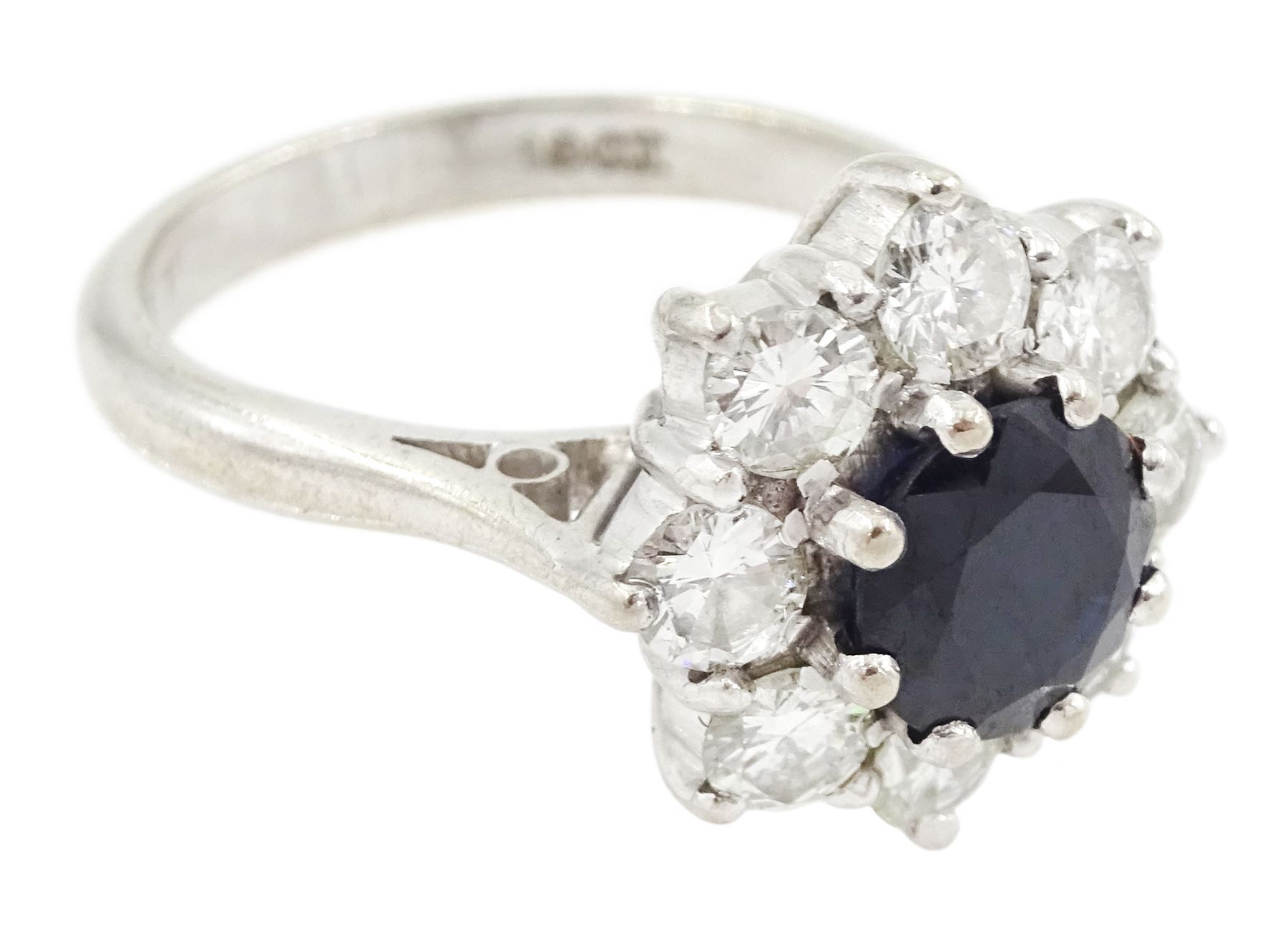 White gold round cut sapphire and round brilliant cut diamond cluster ring, stamped 18ct, sapphire approx 1.35 carat, total diamond weight approx 1.20 carat