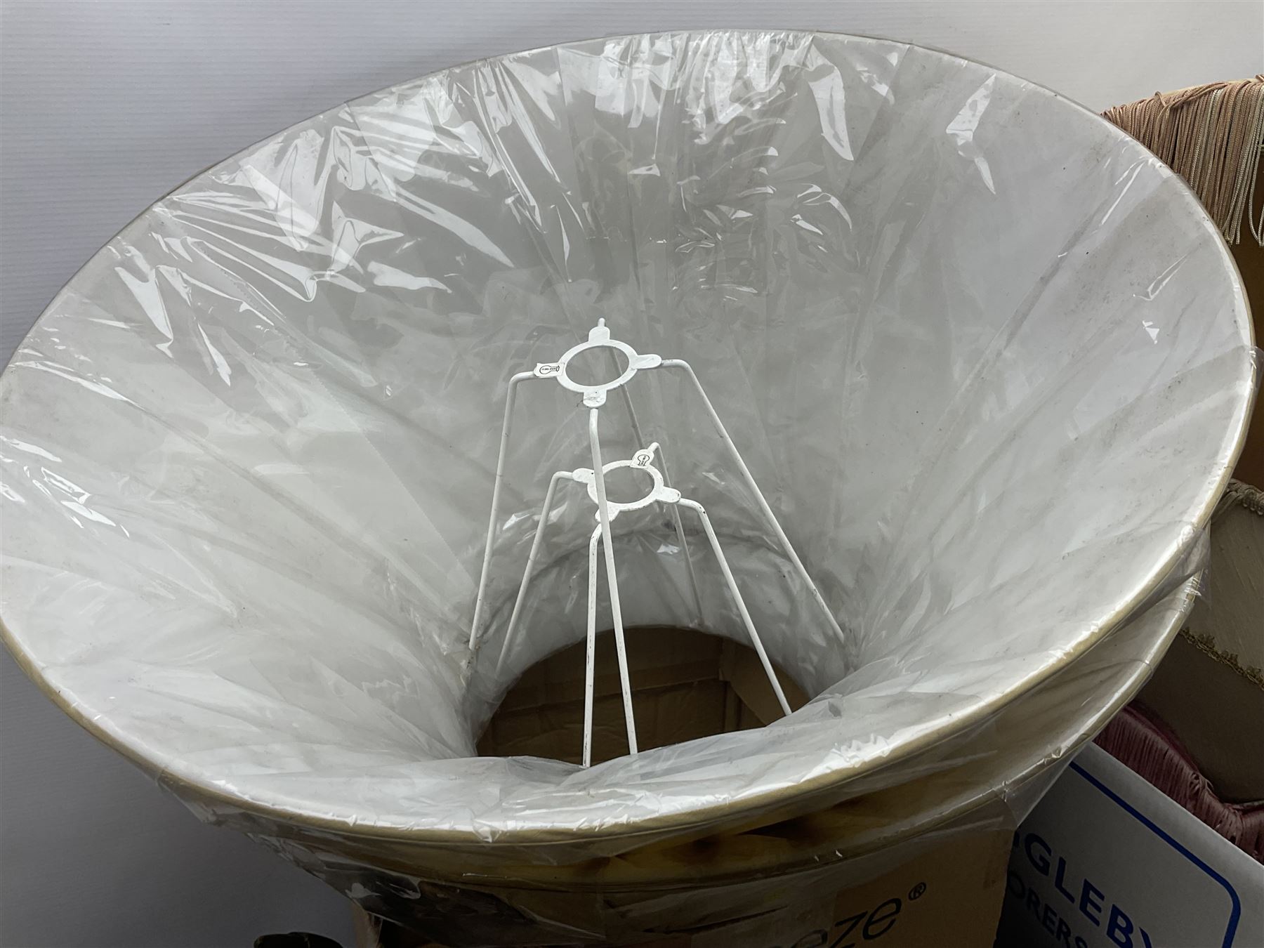 French Adrian helmet and cow horn gong stand; and quantity of lamp shades, etc, helmet H47cm