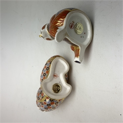 Two Royal Crown Derby paperweights, the first modelled as a Honey Bear, the second as a Walrus, each with print mark beneath, and gold stopper. 