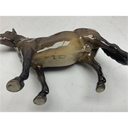 Four Beswick horses, including Exmoor no 1645, Black Beauty foal and two others 
