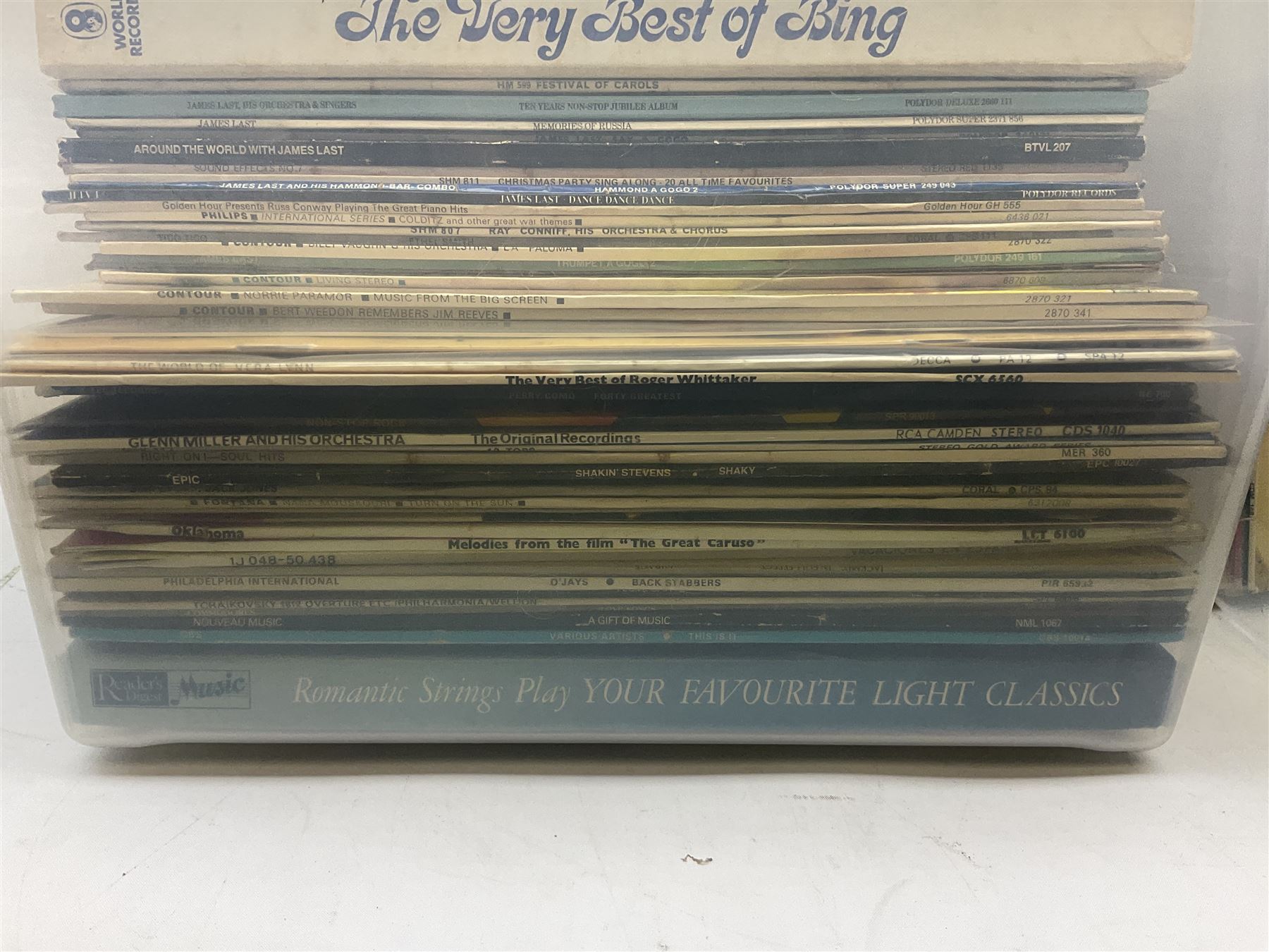 Large quantity of vinyl LPs, predominantly rock and pop, to include Elvis, Elton John, The Kinks, Deep Purple, Eurythmics, Whitney Houston, Phil Collins, Rolling Stones etc, in three boxes, together with quantity of 45 rpm records, Steepletone SRP1R-11 record player and record carry case