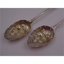 George IV silver fruit serving spoon, the bowl embossed with fruits, with engraved vine leaf decoration to handle, hallmarked London 1789, together with a very similar earlier example, hallmarks worn and indistinct