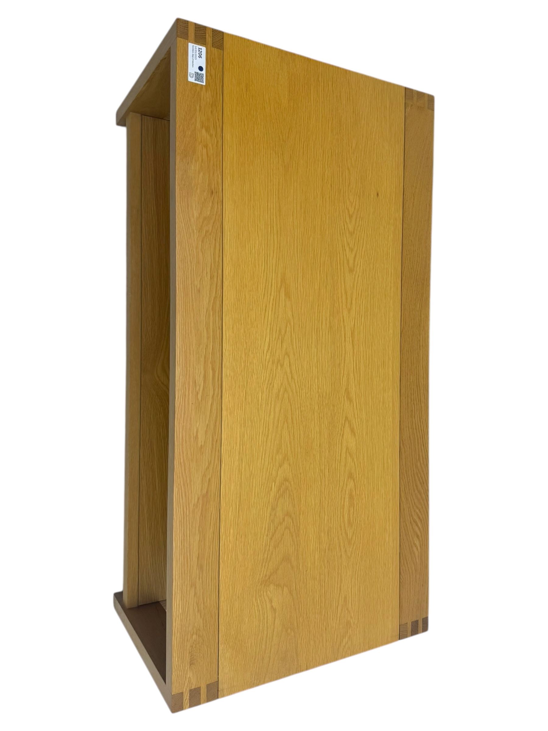 Light oak rectangular coffee table, with exposed finger joints to the corners, raised above a full-length undertier on straight supports