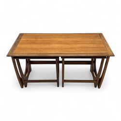 G-Plan - 'Astro' mid mid-century long teak coffee table with two nesting tables, rectangular top with outer banding, above two square top occasional tables on U-shaped end supports united by a stretcher