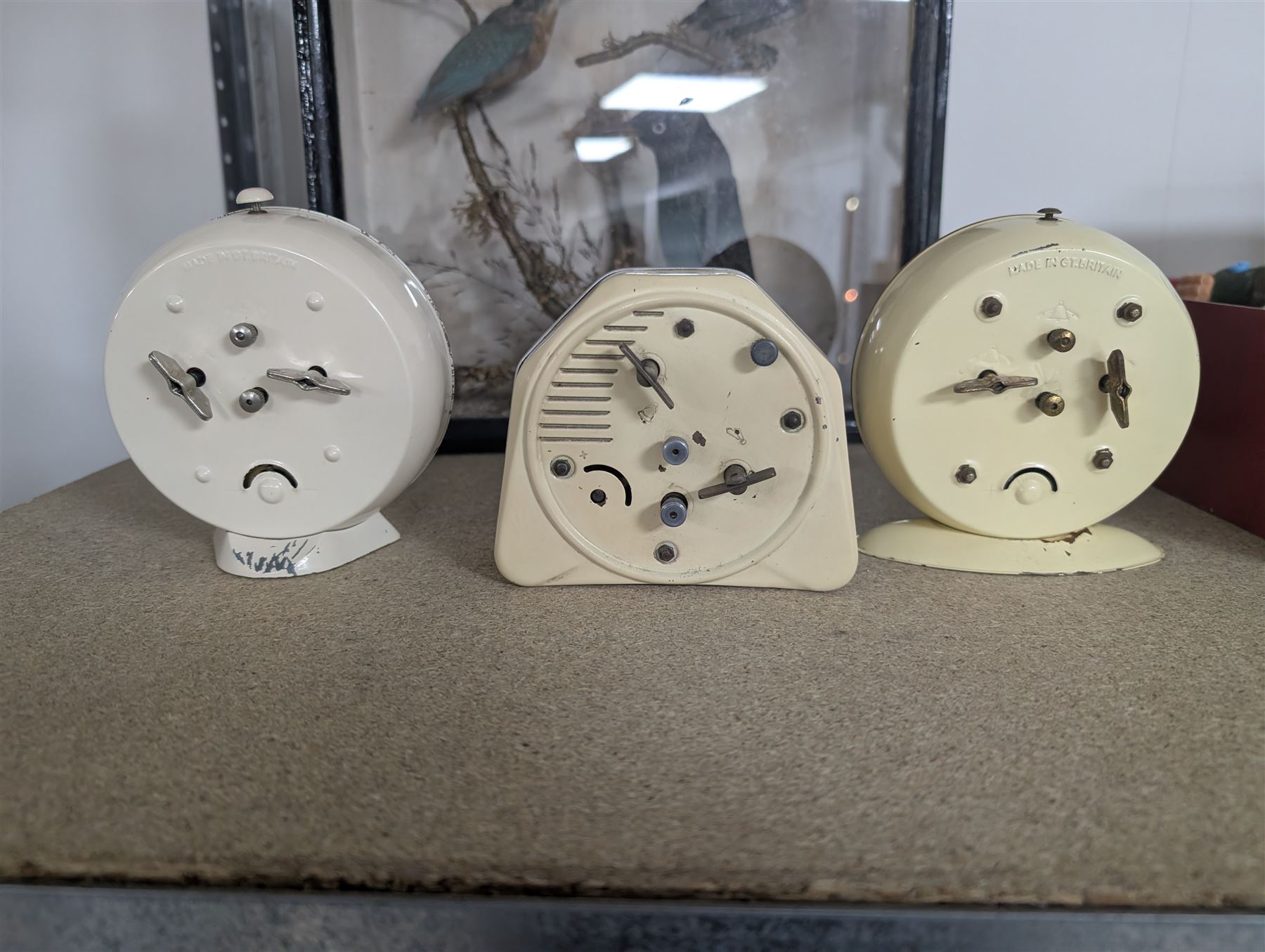 Three Smiths children's alarm clocks, including Noddy, two school adding clocks, Smiths ceramic plate wall clock, Francis Early Bird clock and an Art Deco triangular clock