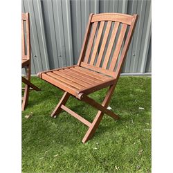 Cotswold Collection - three teak folding garden chairs and foldable table  - THIS LOT IS TO BE COLLECTED BY APPOINTMENT FROM DUGGLEBY STORAGE, GREAT HILL, EASTFIELD, SCARBOROUGH, YO11 3TX