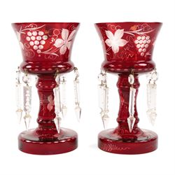 Pair of Victorian ruby glass lustres, with etched grape and vine decoration and clear glas...