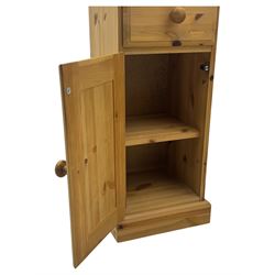 Pair of solid pine traditional design bedside cabinets, one draw above a cupboard with inner shelf