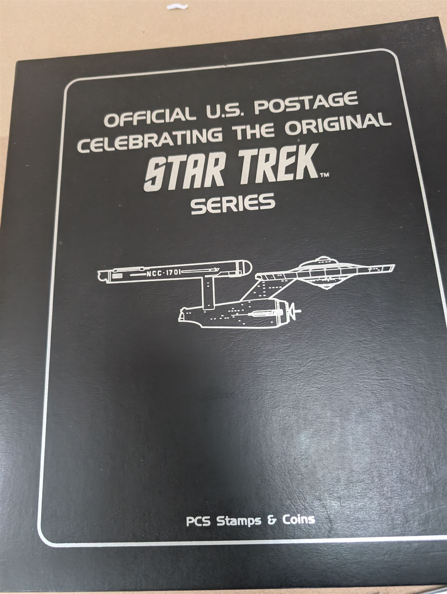 Star Trek collectables, including Danbury Mint '22ct Gold Card Collection', PCS Stamps and Coins Official US Postage Celebrating The Original Star Trek Series, Star Trek St Vincent and Grenadines first day cover collection, four stamp sets and a framed set of similar stamps, commemorative coins, Star Trek The Experience Las Vegas coin, three commemorative 'gold stamps' and three albums of collectors cards and telephone cards