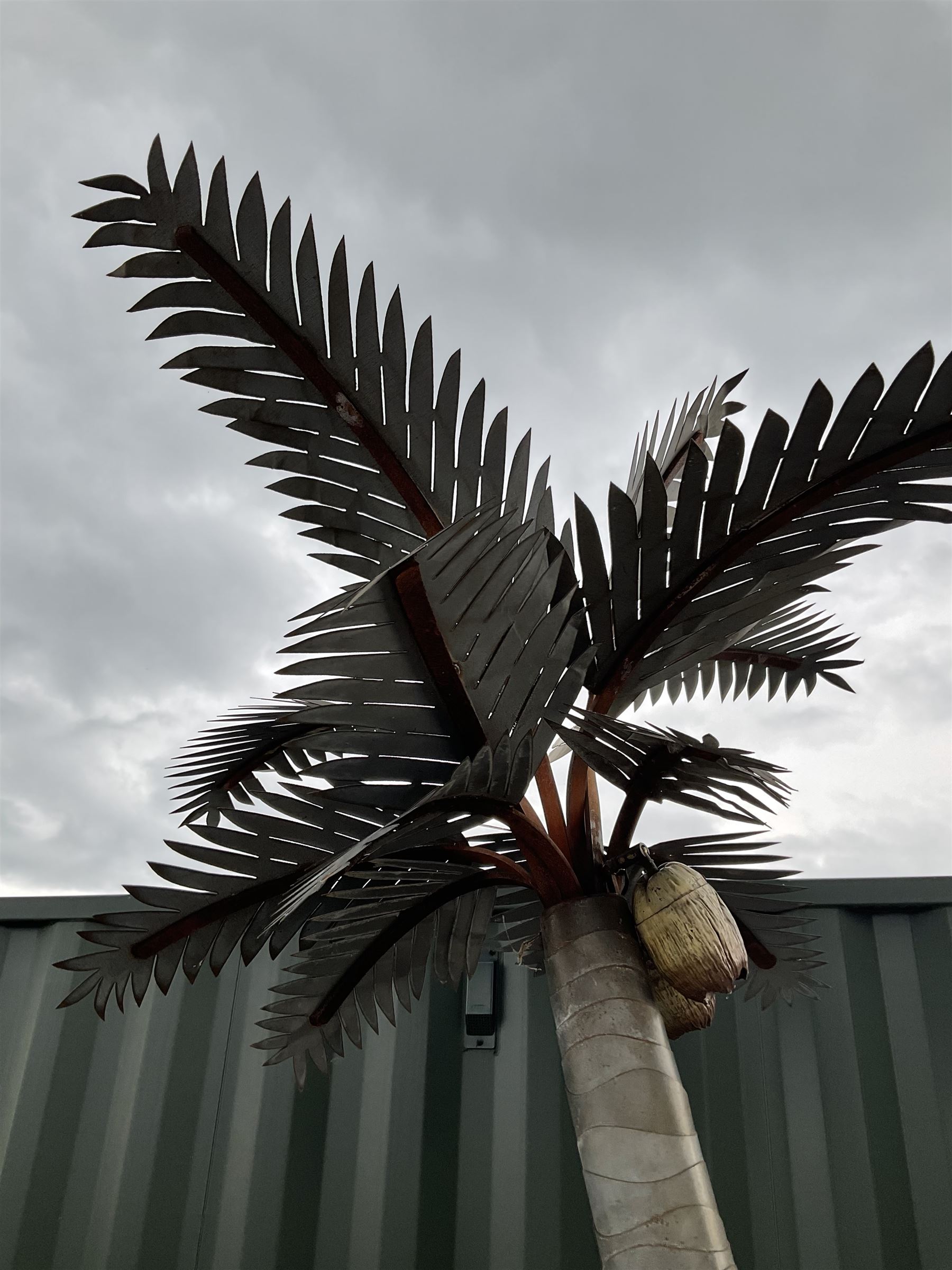 Designer Palms - shaped metal full size palm tree, double curved trunk with large metal fronds and pair of coconut lights, on rectangular base - THIS LOT IS TO BE COLLECTED BY APPOINTMENT FROM DUGGLEBY STORAGE, GREAT HILL, EASTFIELD, SCARBOROUGH, YO11 3TX