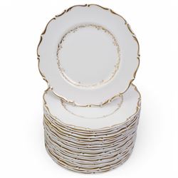 Royal Doulton dinner service in the 'Richelieu' pattern, comprising eleven dinner plates, twenty one dessert plates, twelve soup bowls, eleven dessert bowls, four vegetable dishes, oval serving dishes and graduating meat plates 