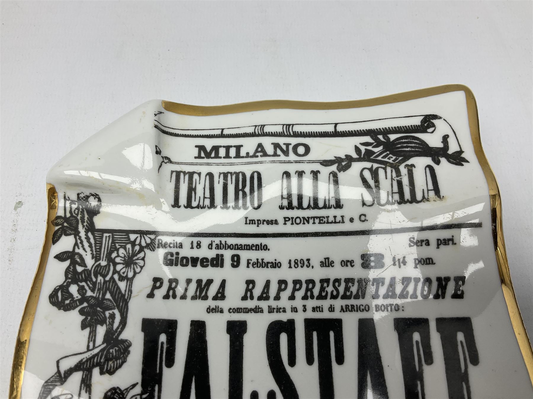 Fornasetti rectangular 'Falstaff' operatic billboard ashtray decorated with black and white text with a gilt border edge,  with printed mark beneath, H22cm 
