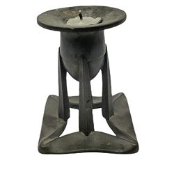 Liberty & Co Tudric pewter candlestick designed by Archibald Knox, the bullet shaped socket upon four tapering supports and folded open square foot, stamped beneath Tudric 0222, H10cm