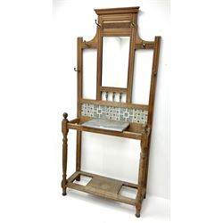 Edwardian walnut hallstand with centre mirror and tiled back, sing, single marble shelf, turned supports joined by undertier, six hooks