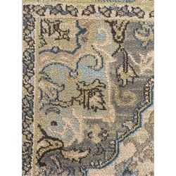 Ziegler-style machine-made rug, beige ground with a multicoloured central medallion and floral motifs, spandrels with scrolling designs, framed by a decorative border with intricate patterns