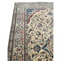 Fine Nain rug, ivory ground and decorated with pointed pole medallion, the field with interlacing branch and stylised plant motifs, decorated with birds, the border with repeating floral scroll design 