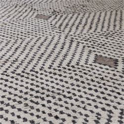 Contemporary Beni Ourain style wool rug, woven with a cream field and dark brown geometric chevron lattice, centred by repeating small diamond medallions, with short fringe ends