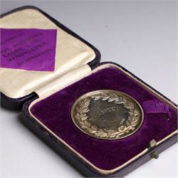 Collection of silver medals, mainly with an agricultural theme, including Poultry Club, Heywood Bicycle Club, heart shaped fob, four within leather cases 