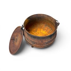 Three South African cast iron graduating cooking pots with lids and handles. Size shown for the largest