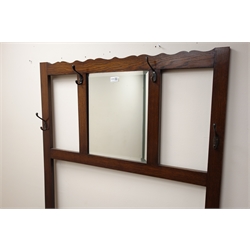  Early 20th century oak hall stand, raised bevelled mirror back with hooks, hinged box seat, W92cm, H175cm, D38cm  