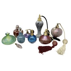 Art glass atomisers to include a Royal Brierley bottle of typical form with mottled iridescent decoration and signed to base, a blue scent bottle with trailed swag decoration, probably Sanders and Wallace, signed 'S and W' beneath, and six other art glass perfume bottles with of various forms with swirled designs and captured bubble decoration