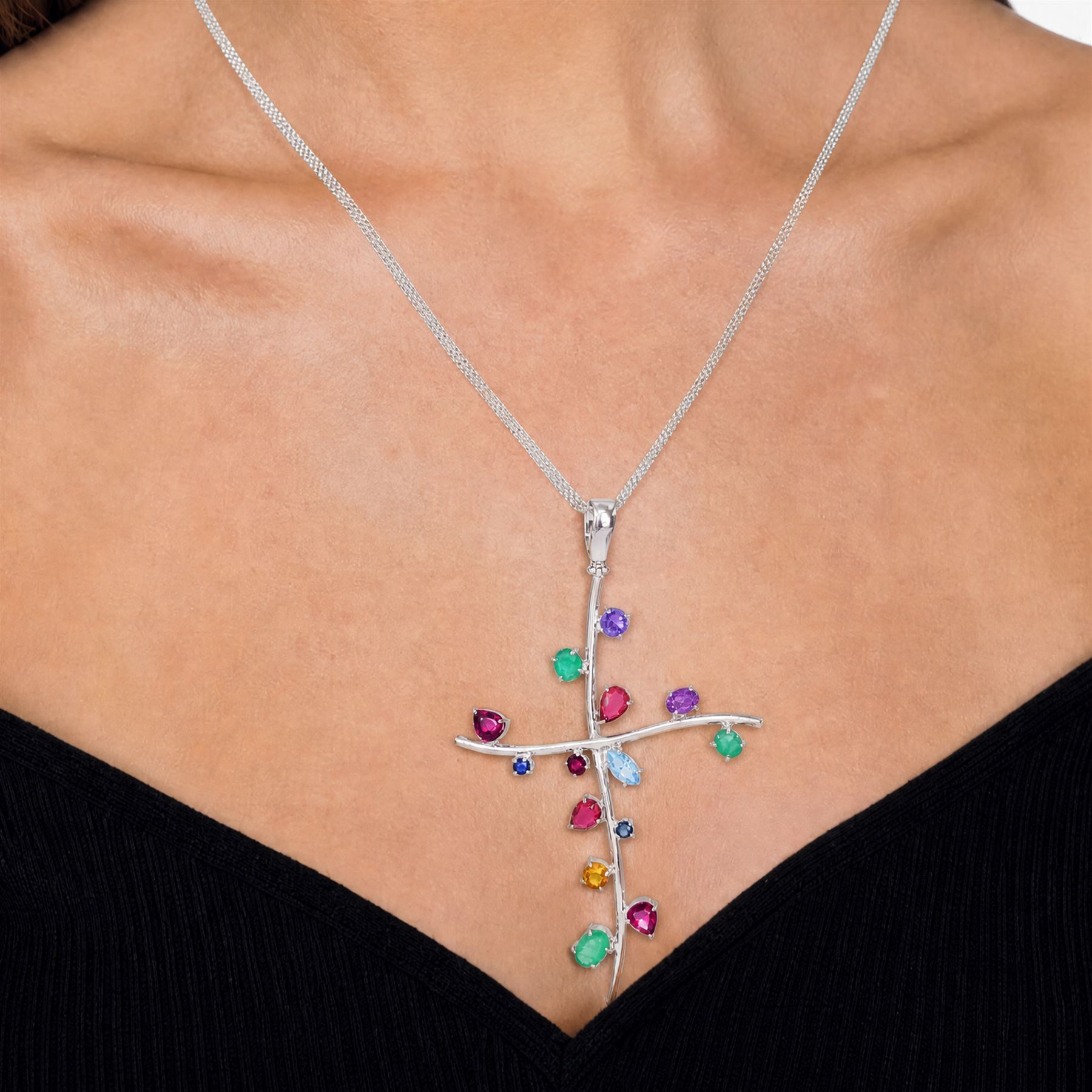 18ct white gold multi gemstone cross pendant necklace, vari-cut stones including emerald, ruby, pink and blue sapphire, red and blue stones, on a four strand box link chain necklace, stamped 750