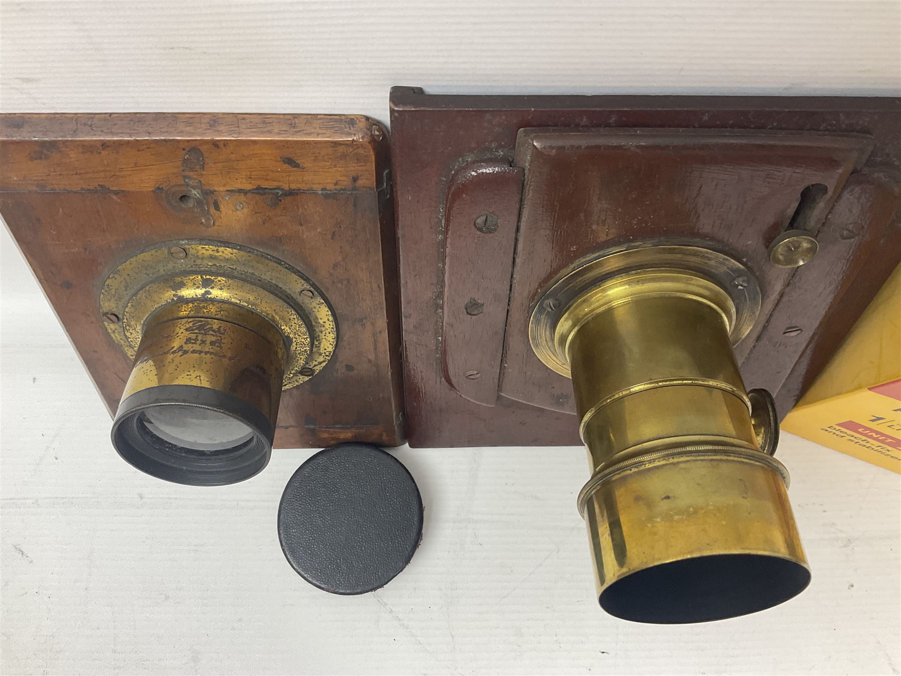 Selection of Brass Camera Lenses, to include Ross London lens 8 1/2 x 6 1/2, Beck Symmetrical lens, etc together with lens holders 