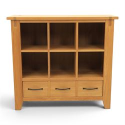 Contemporary Oak cabinet, rectangular top with tenon detailing, two open recess shelves, above a single drawer with blackened metal handles