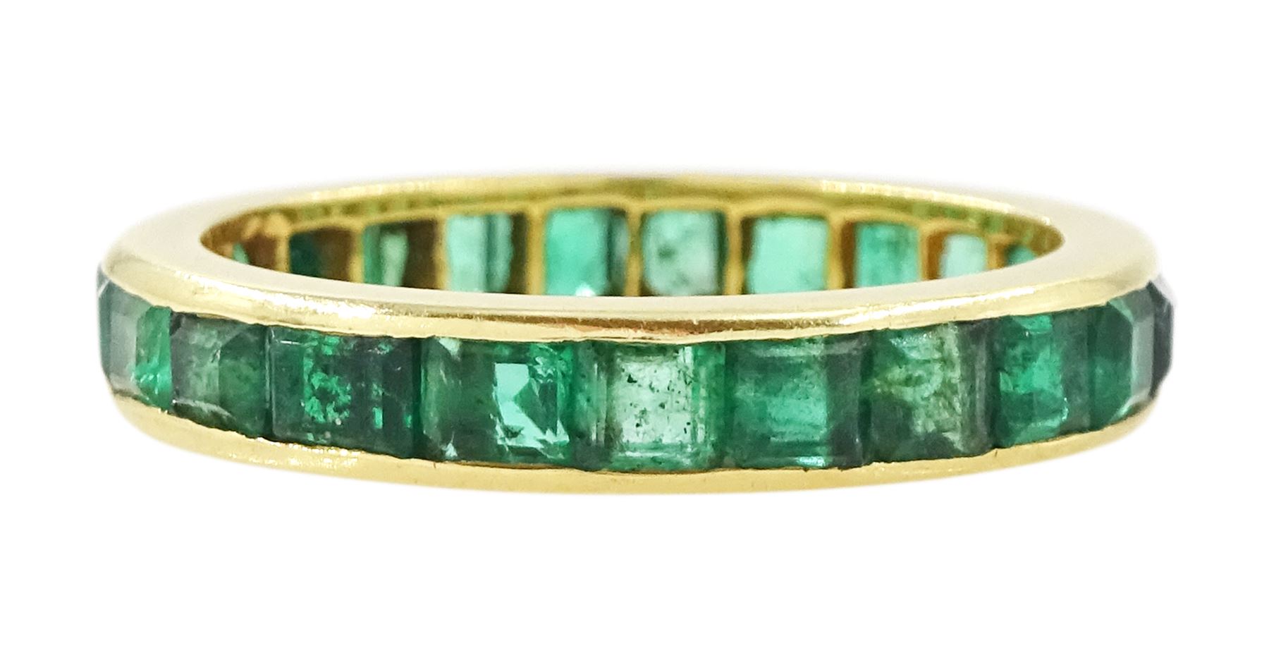18ct gold emerald full eternity ring, channel set with calibre cut emeralds