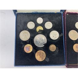 Three King George VI 1951 'Festival Of Britain' specimen coin sets, each comprising farthing to crown coins, housed in maroon, green and blue dated boxes 