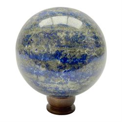 Lapis lazuli sphere upon a carved wooden base 