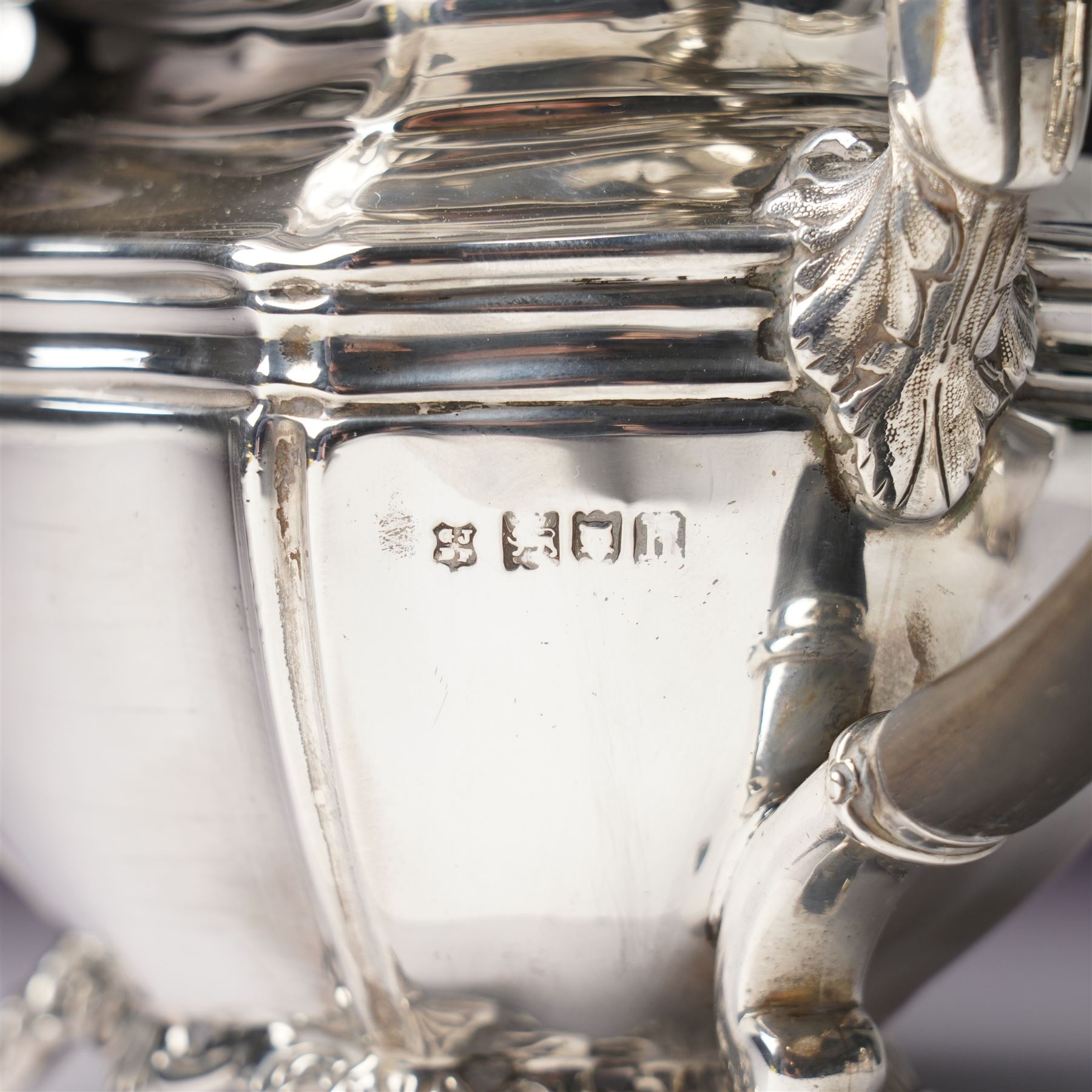 Edwardian silver three piece bachelors tea set of panel sided rectangular form with shell and scroll borders on shell moulded feet London 1903- 1905 Maker Josiah Williams & Co