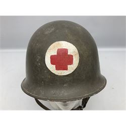 French Algerian War Red Cross steel helmet, marked 'CP ICA Esperaza 1955'; green finish with crudely painted Red Cross logo to the front