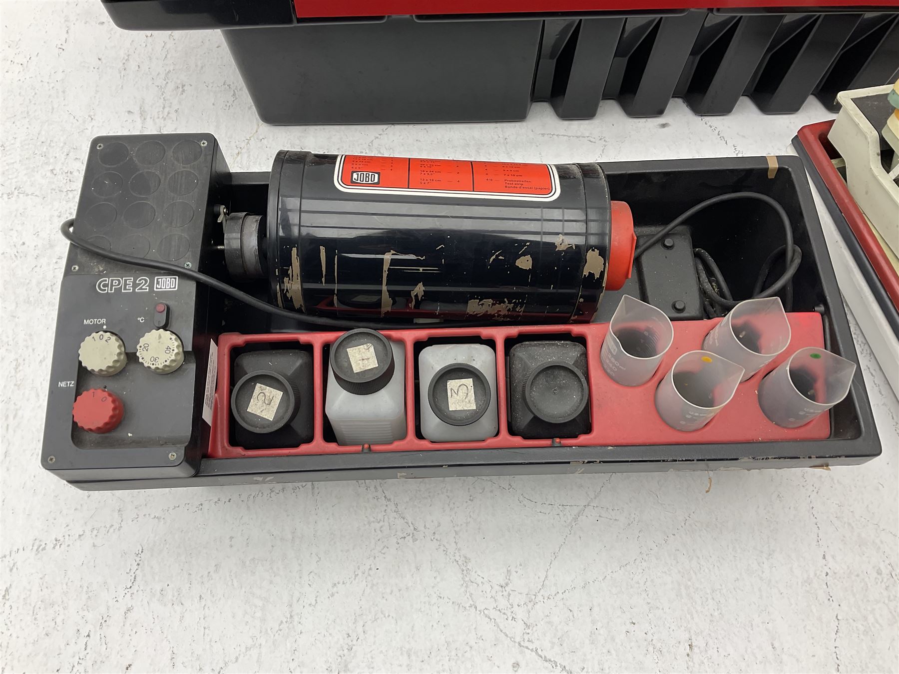 Jobo Colorprocessor CPA 2  fitted with a JoboDrum 2830 drum, DrumModul 2870, three plastic cylinders and six chemistry storage bottles, Jobo Colorprocessor CPA 2, fitted with JoboDrum 4531, four plastic cylinders and 4 chemical storage bottles, and nineteen development trays of various sizes, all untested